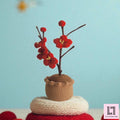 Gehäkelte Blume im Topf Pflaumenblüte