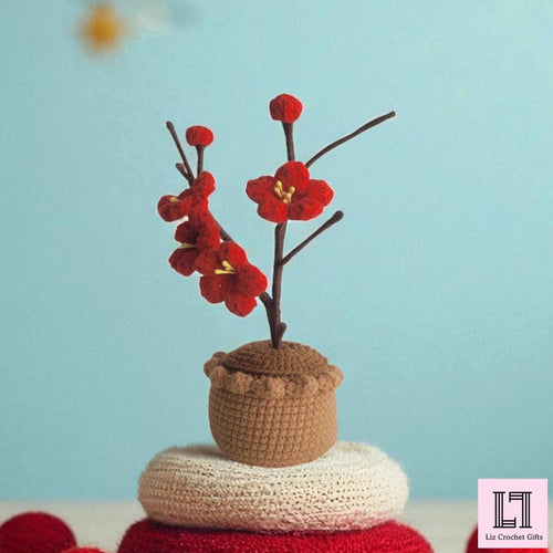 Gehäkelte Blume im Topf Pflaumenblüte