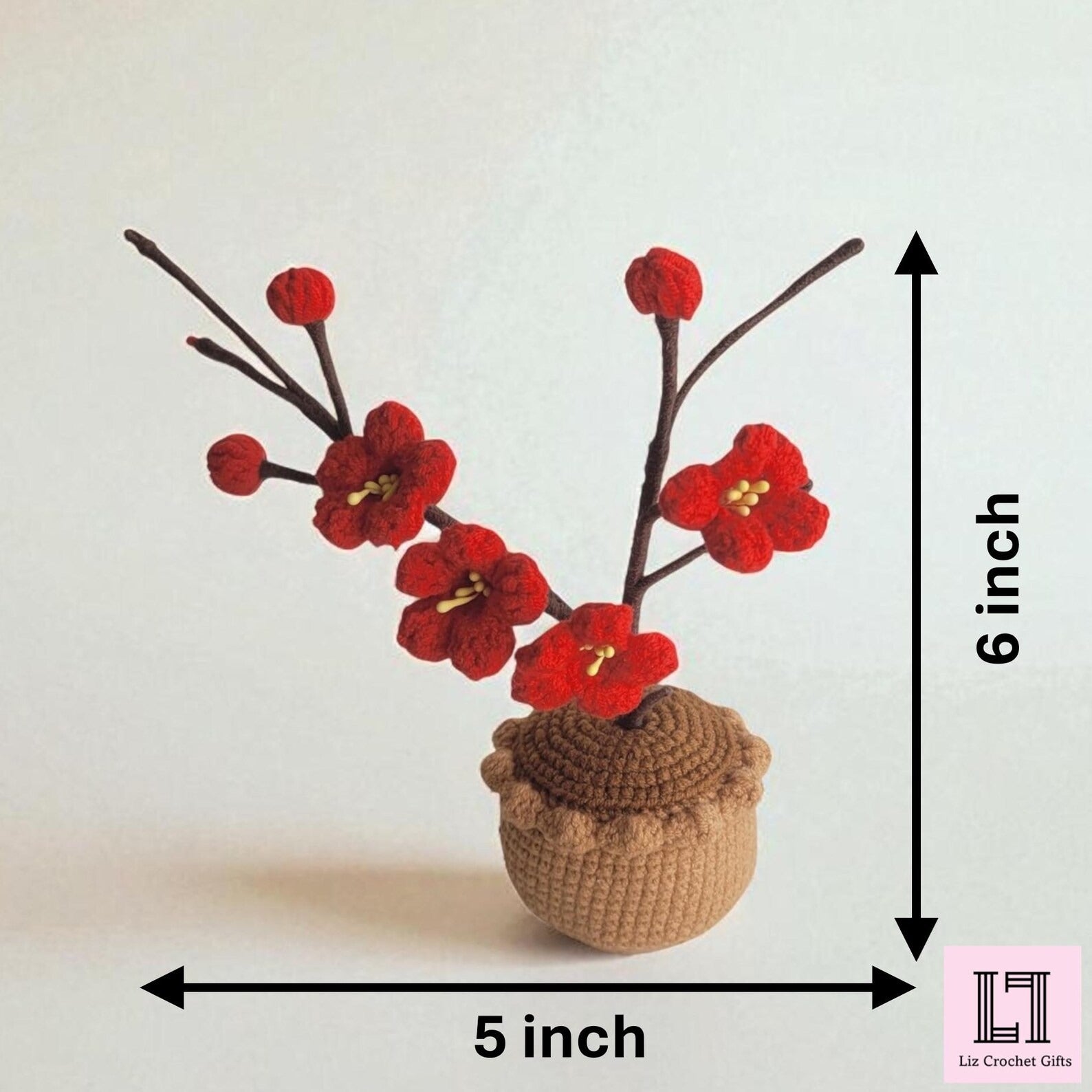 Gehäkelte Blume im Topf Pflaumenblüte