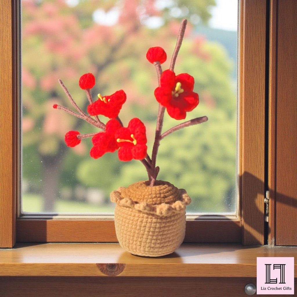 Gehäkelte Blume im Topf Pflaumenblüte