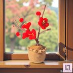 Gehäkelte Blume im Topf Pflaumenblüte